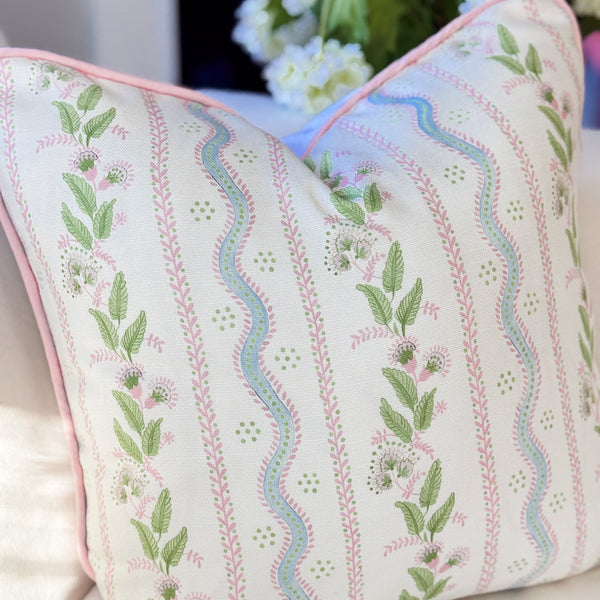 Decorative pillow with floral embroidery on a couch